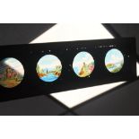 FOURTEEN 14" HAND PAINTED MAGIC LANTERN SLIDE STRIPS together with a mechanical example