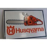 A VINTAGE "HUSQVARNA" CHAINSAW PRESSED METAL ADVERTISING SIGN, 96.5 x 68 cm