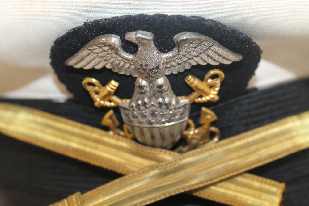 A VINTAGE US NAVY PEAK CAP with all weather cover, an associated jacket and an Airbourne (?) side c - Image 4 of 4