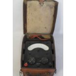 A UNIVERSAL AVO METER, in fitted leather case