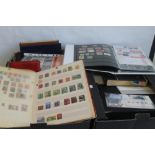 A LARGE COLLECTION OF STAMPS MAINLY IN ALBUMS, to include first day covers, Royal Mint annual sets,