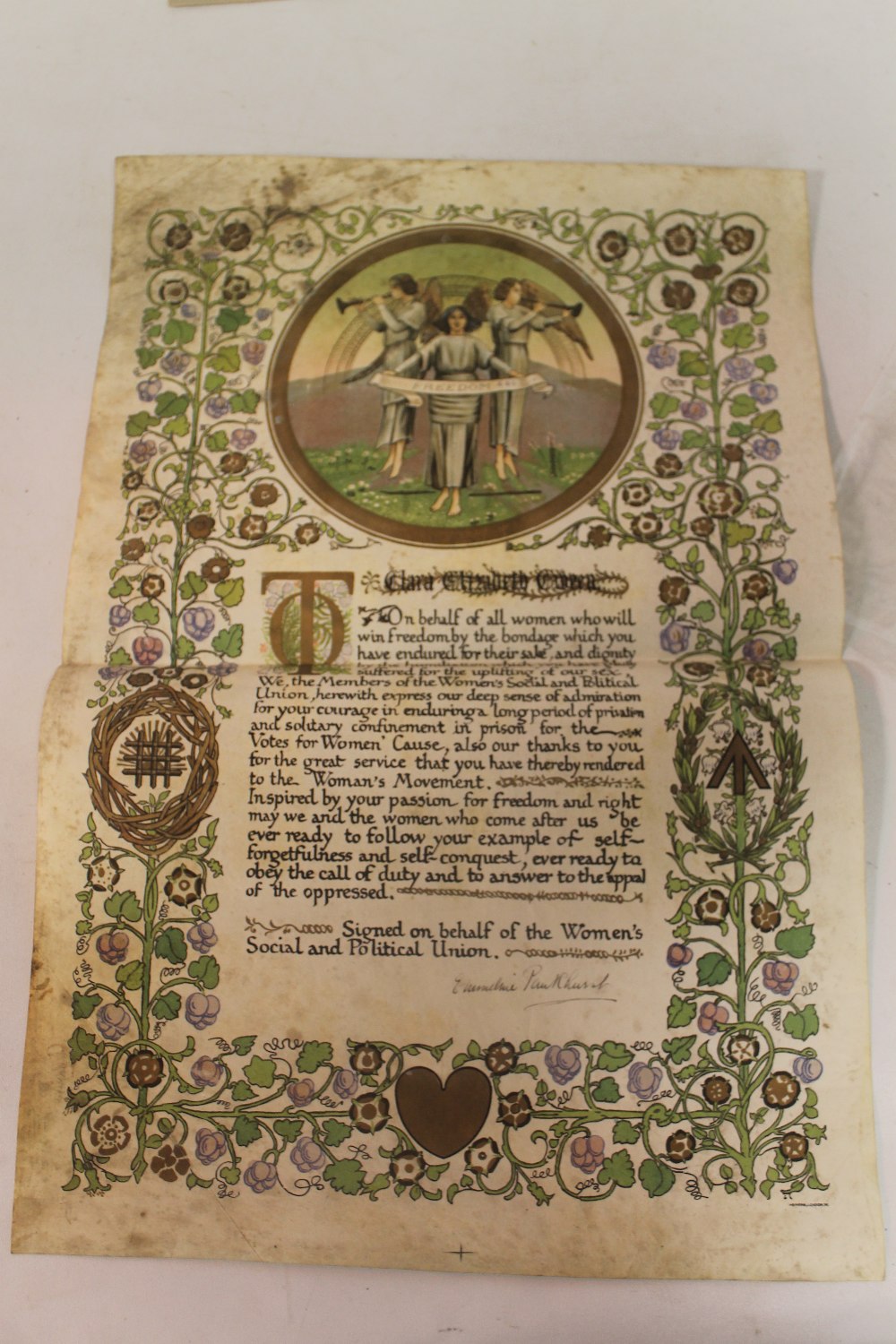 A SUFFRAGETTE ILLUMINATED ADDRESS NAMED TO "CLARA ELIZABETH GIVEEN", signed in black ink by Emmelin - Image 2 of 10