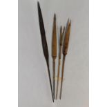 A VINTAGE FISHING SPEAR together with three possible monkey spears (?) (4)