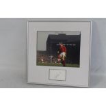 A FRAMED AND GLAZED BOBBY CHARLTON SIGNED AUTOGRAPH DISPLAY