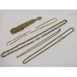 A QUANTITY OF YELLOW METAL CHAINS ETC