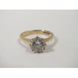 A LADIES 9CT GOLD SOLITAIRE RING SET WITH A LARGE CLEAR STONE