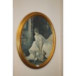 A LARGE GILT OVAL FRAMED PRINT OF A SEATED LADY