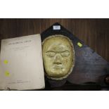 AN OAK MOUNTED DEATH MASK TOGETHER WITH AN ANATOMICAL ATLAS