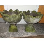 A PAIR OF STONE PLANTERS WITH LEAF DETAIL