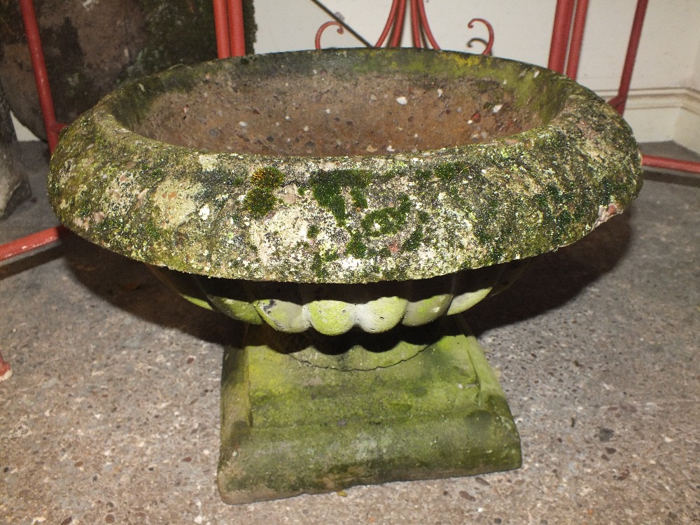 A SMALL CIRCULAR BIRD BATH