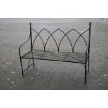 A METAL GARDEN BENCH