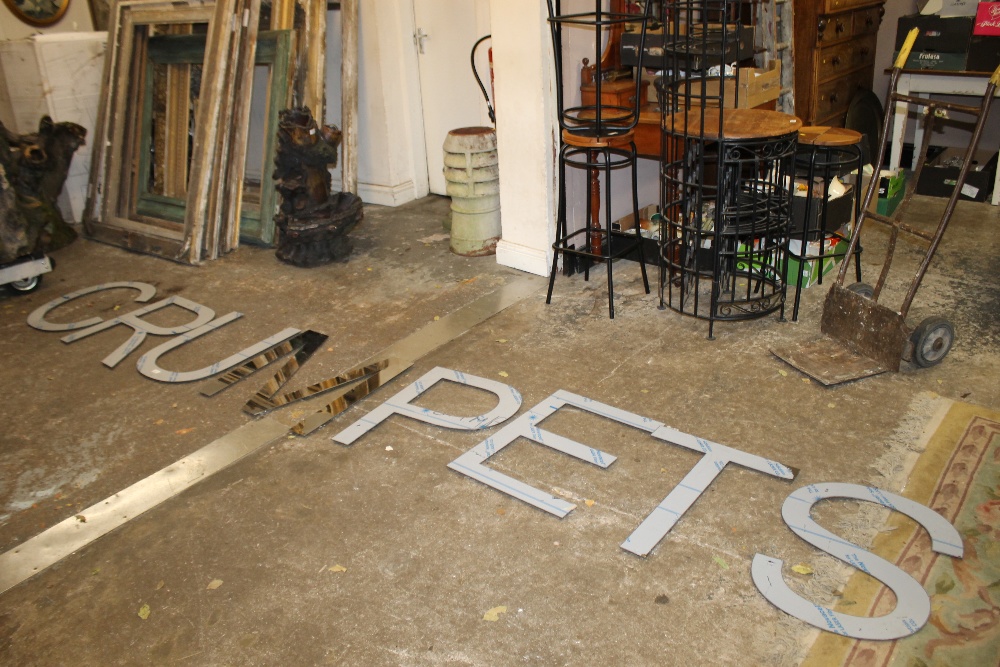 A QUANTITY OF LARGE MIRRORED WALL HANGING LETTERS : C.R.U.M.P.E.T.S