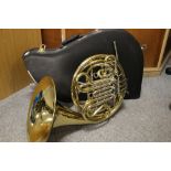 A BRASS HOLTON H180 DOUBLE FRENCH HORN COMPLETE WITH RIGID CARRY CASE