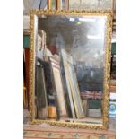 A MODERN GILT FRAMED MIRROR