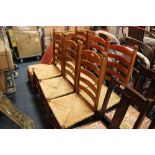 A SET OF SIX OAK WICKER SEAT DINING CHAIRS