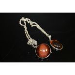 A VINTAGE SILVER AND AMBER PENDANT OF CHAIN TOGETHER WITH A BROOCH