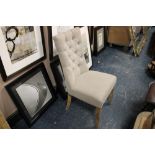 A MODERN UPHOLSTERED BEDROOM CHAIR