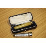 A CASED CHEROOT HOLDER WITH YELLOW METAL BAND STAMPED 18 TOGETHER WITH A HALLMARKED SILVER CHEROOT