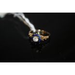 A LADIES 9CT GOLD DRESS RING SET WITH BLUE AND CLEAR STONES