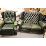 A GREEN LEATHER UPHOLSTERED TWO SEATER SETTEE & AN ARMCHAIR (2)