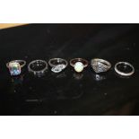 A QUANTITY OF SILVER AND WHITE METAL DRESS RINGS