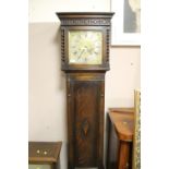 AN EARLY 20TH CENTURY OAK LONGCASE CLOCK WITH BARLEYTWIST DETAIL