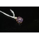 A HALLMARKED 9 CARAT GOLD AMETHYST AND DIAMOND PENDANT, measuring approx 10 mm x 10 mm