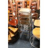 A SET OF FOUR MODERN INDUSTRIAL TYPE STACKING STOOLS (4)