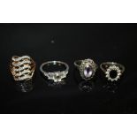 FOUR ASSORTED SILVER DRESS RINGS