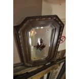 AN OAK FRAMED MIRROR WITH FLORAL DECORATION