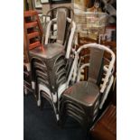 A MIXED SET OF NINE INDUSTRIAL METAL STACKING CHAIRS (9)