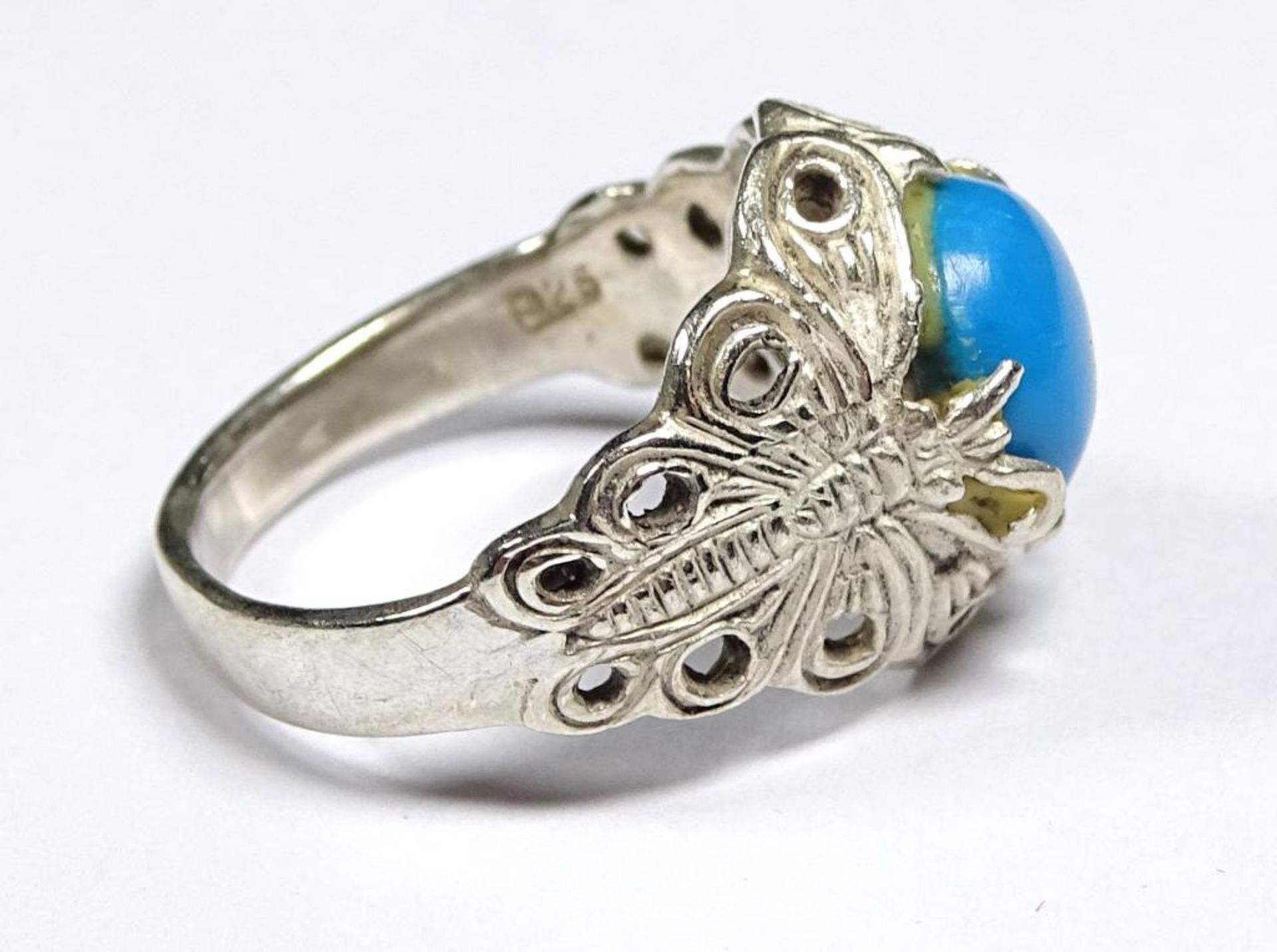 Ring, 925er Silber,seitlich Schmetterlingsmotive,blauer Stein Besatz-dieser geklebt,4,9gr., RG 57 - Bild 2 aus 3