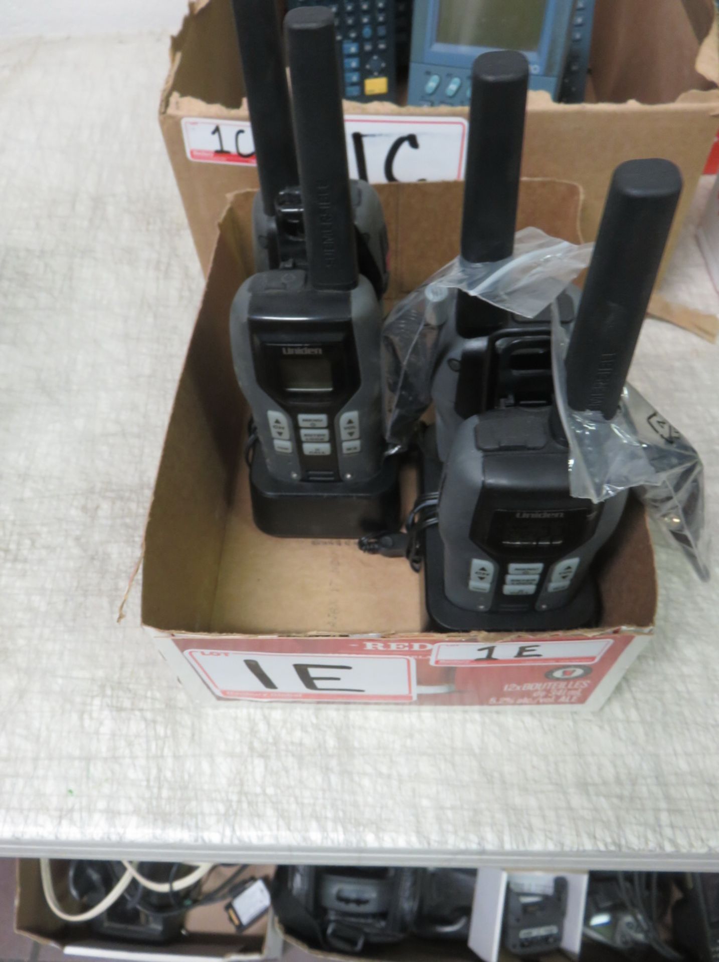 LOT - (4) UNIDEN SUBMERSIBLE 2-WAY RADIOS W/ (2) 2-BAY CHARGERS