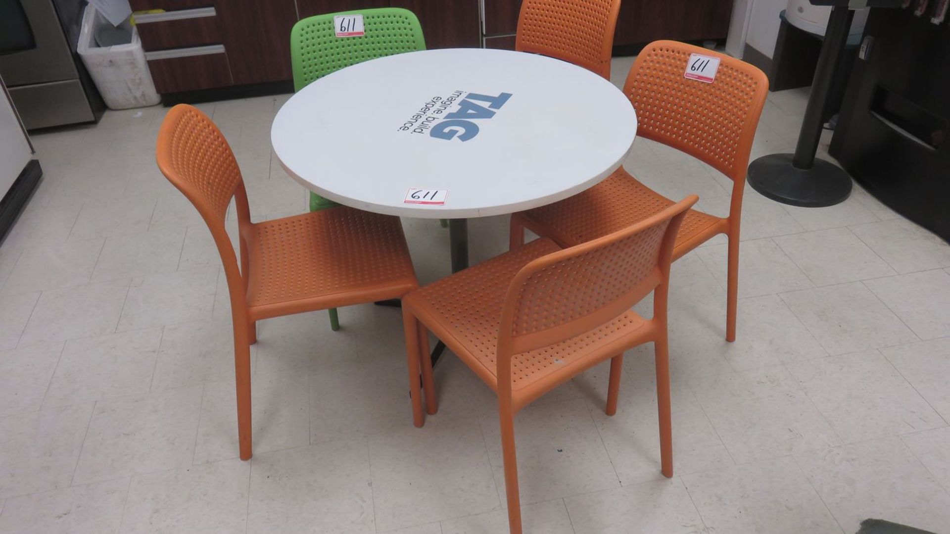 LOT - WHITE PEDESTAL TABLES (4 UNITS) C/W (10) ORANGE & GREEN PLASTIC CHAIRS