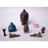 Sammlung von asiatischen Kleinplastiken8-tlg., verschiedene Materialien wie Keramik, Stein,