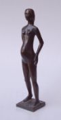Stehende schwangere AktfigurBronze mit dunkelbrauner Patina, Höhe 41cm, am Sockel monogrammiert "