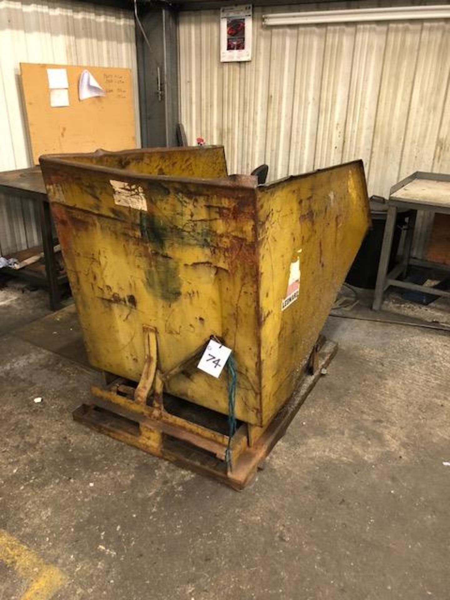 Fork lift tipping skip and mixed scrap contents