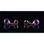 A pair of silver gilt, diamond, and amethyst drop earrings stamped 925, each with a pear cut