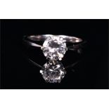 An 18ct white gold and solitaire diamond ring set with a round brilliant-cut diamond of