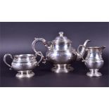 A mid-20th century three-piece silver tea set Birmingham 1956, by Adie Brothers Ltd. comprising: a