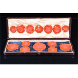 A collection of fourteen red wax seals of varying shapes and sizes, (largest 4.5 cm diameter),