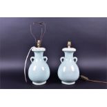 A pair of 20th century Chinese celadon glazed vases now converted to lamp bases, with twin handles