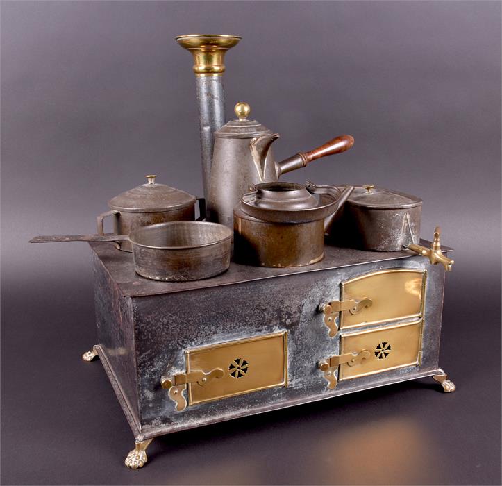 A Marklin tinplate Child’s Cooking range circa 1900, the oven with two pierced and one plain brass