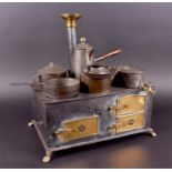 A Marklin tinplate Child’s Cooking range circa 1900, the oven with two pierced and one plain brass