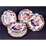 Eleven 19th century dinner plates in the Imari palette together with a part dinner plate, in the