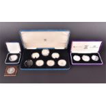 A set of seven silver Queen Elizabeth the Queen Mother 80th Birthday commemorative coins in a fitted