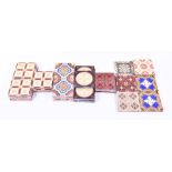 A collection of thirty one Victorian encaustic and ceramic tiles many in the Neo Gothic taste, to