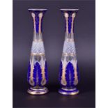 A pair of 19th century Bohemian blue and gilt overlay tall vases with vertical acanthus leaf-style