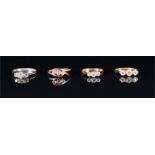 An 18ct white gold and diamond ring set with three round brilliant-cut diamonds of approximately 0.
