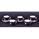 Five 19th century Meissen cabinet cups and saucers probably outside decorated with hand painted